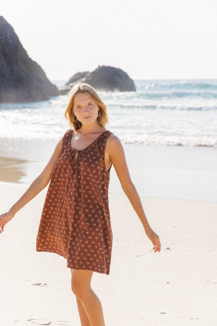 Sundress Mini Almond — model in heritage courtyard, full length portrait, mini dress in traditional Indian architecture setting, almond cotton hand block print | Daughters of India